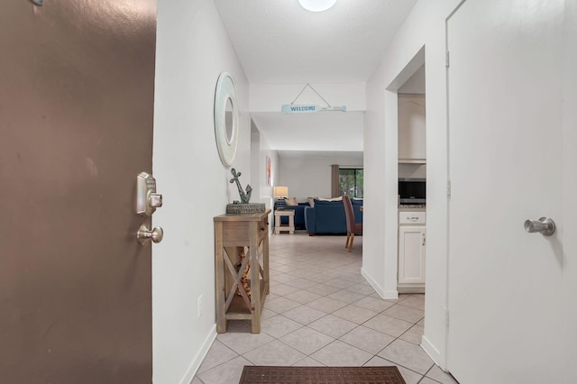 corridor featuring light tile patterned flooring