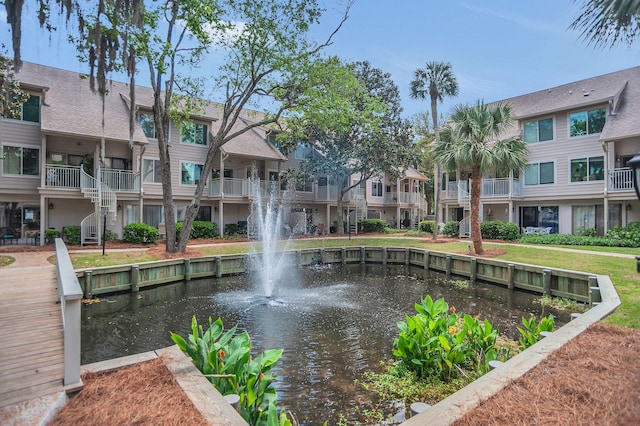 view of home's community featuring a water view