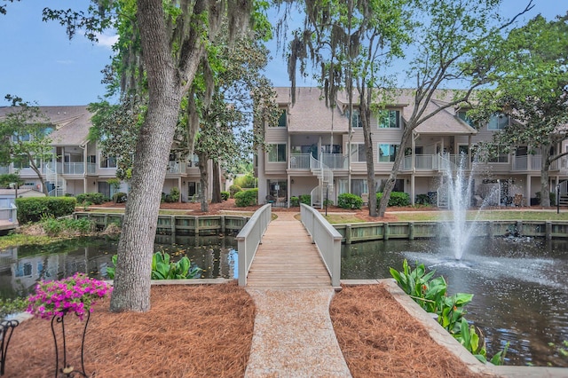 surrounding community featuring a water view