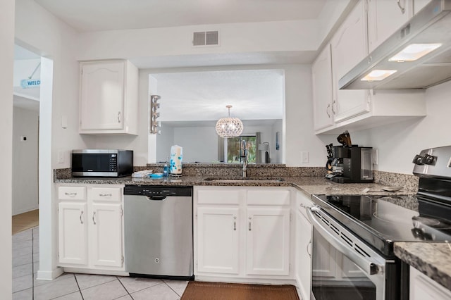 kitchen with white cabinetry, appliances with stainless steel finishes, sink, and light tile patterned flooring