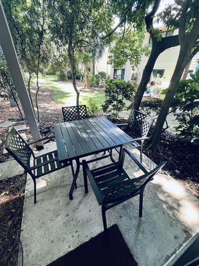 view of property's community with a patio area