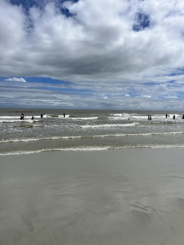 view of water feature with a beach view