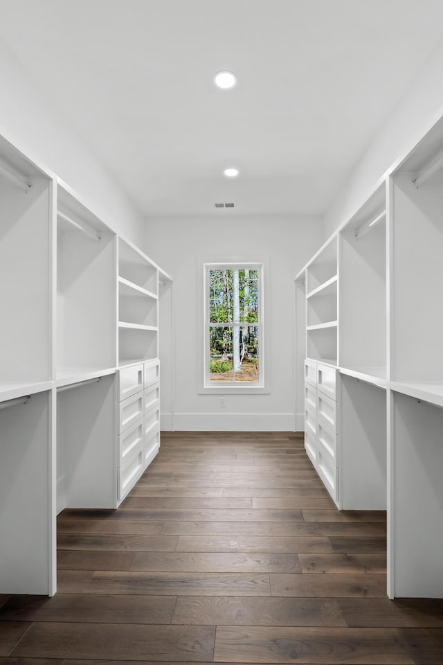 walk in closet with dark wood-style floors and visible vents