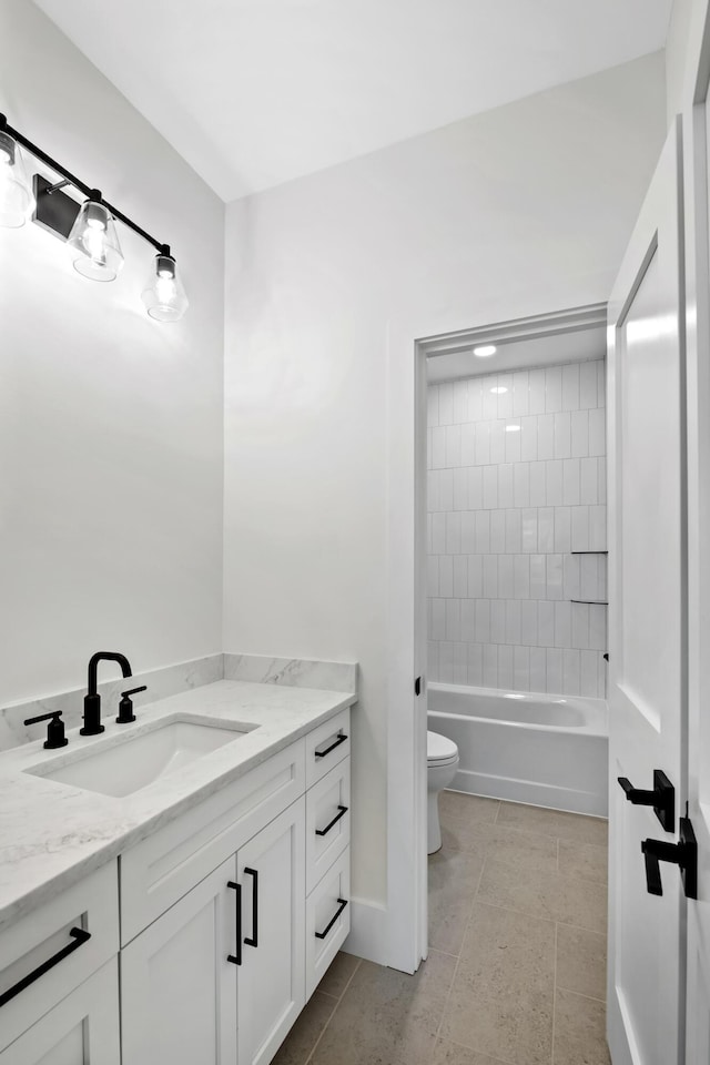 bathroom with toilet, tile patterned floors, shower / bathing tub combination, and vanity