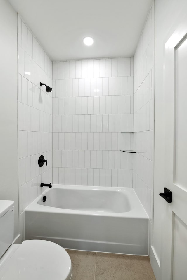 bathroom with shower / washtub combination and toilet