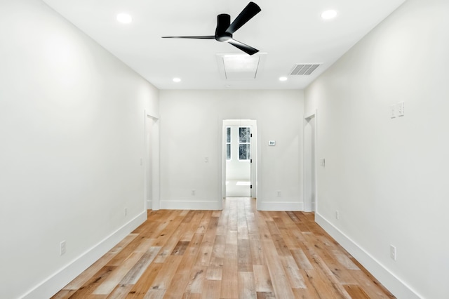 empty room featuring ceiling fan, light wood-style flooring, visible vents, and recessed lighting