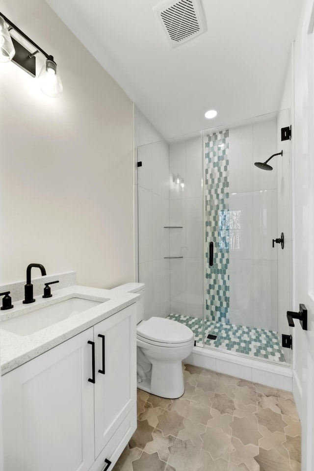 full bath featuring visible vents, a shower stall, toilet, and vanity