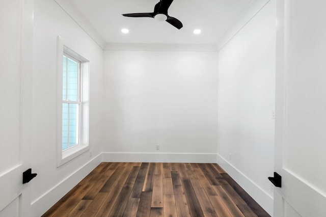 spare room featuring a wealth of natural light, dark wood-style flooring, baseboards, and recessed lighting