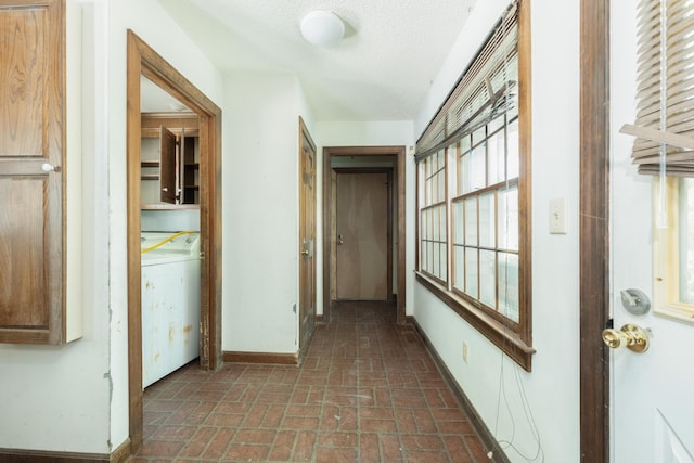 200 Old Postern Rd, Summerville, SC 29483 - hall featuring brick patterned floors, baseboards, washer / dryer, and a textured ceiling