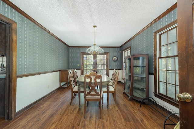 200 Old Postern Rd, Summerville, SC 29483 - dining space featuring ornamental molding, a textured ceiling, wood finished floors, a chandelier, and wallpapered walls