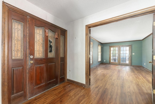 200 Old Postern Rd, Summerville, SC 29483 - entryway featuring wood finished floors, baseboards, a textured ceiling, and ornamental molding