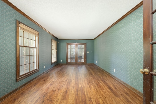 200 Old Postern Rd, Summerville, SC 29483 - empty room with crown molding, wood finished floors, healthy amount of natural light, wallpapered walls, and baseboards