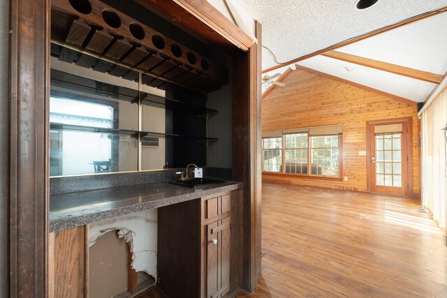 200 Old Postern Rd, Summerville, SC 29483 - bar with vaulted ceiling, a sink, wooden walls, light wood-style floors, and ceiling fan