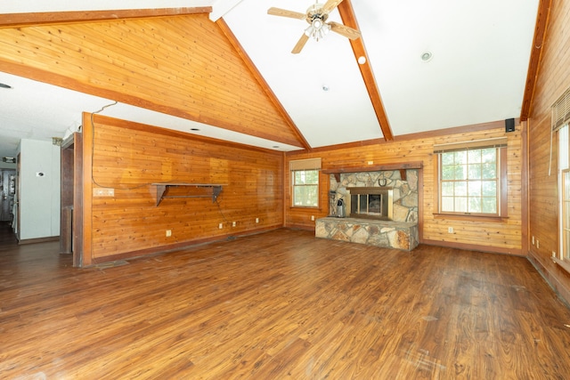 200 Old Postern Rd, Summerville, SC 29483 - unfurnished living room with wood walls, beam ceiling, a ceiling fan, wood finished floors, and high vaulted ceiling
