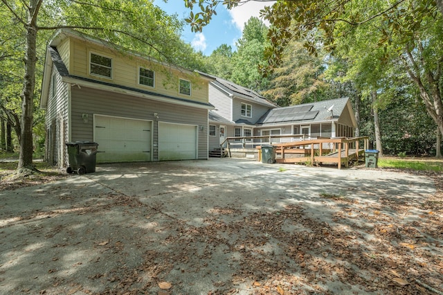 200 Old Postern Rd, Summerville, SC 29483 - view of front facade with an attached garage, a wooden deck, and driveway