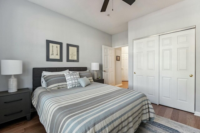 bedroom featuring ceiling fan, a closet, and wood finished floors