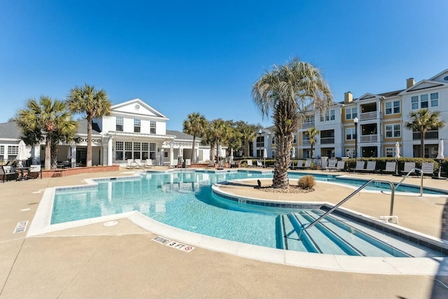 community pool with a patio area