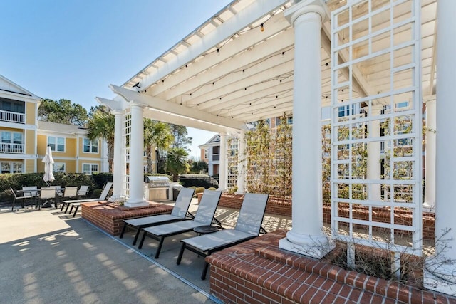 view of patio / terrace with an outdoor kitchen and a grill