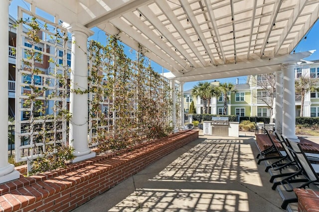 view of patio featuring an outdoor kitchen and area for grilling