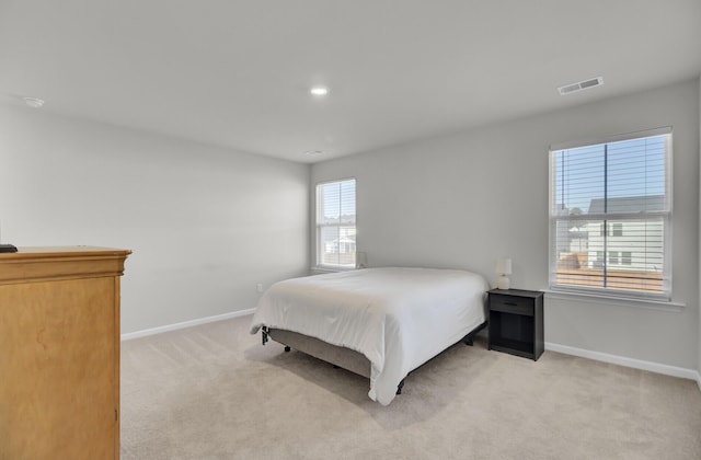 bedroom featuring recessed lighting, baseboards, visible vents, and light colored carpet