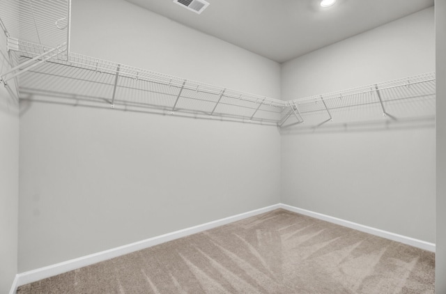 spacious closet with carpet and visible vents