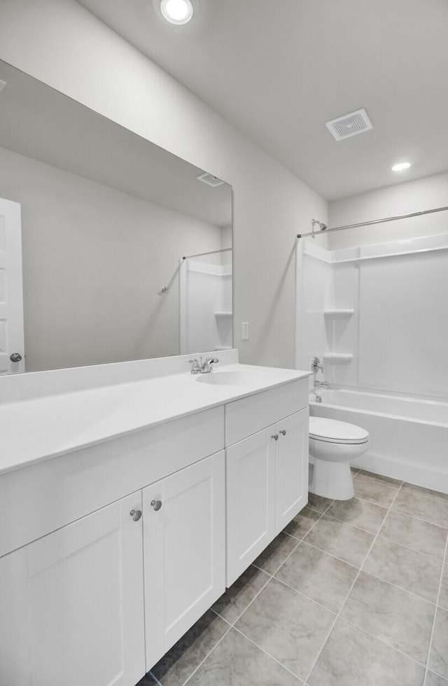 bathroom with toilet, vanity, visible vents, tub / shower combination, and tile patterned floors