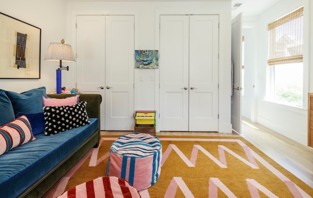 living room with hardwood / wood-style floors and a healthy amount of sunlight