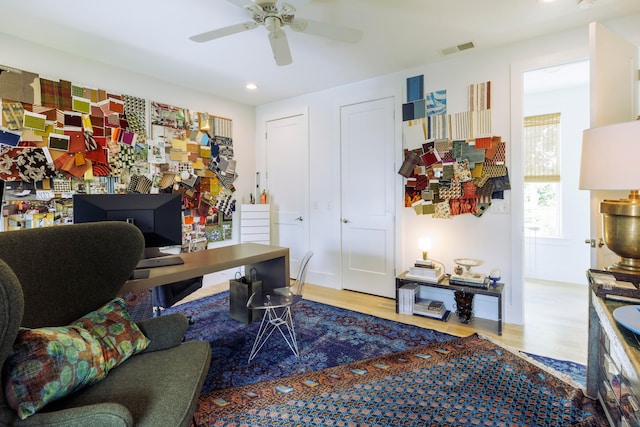 office space featuring ceiling fan and hardwood / wood-style floors