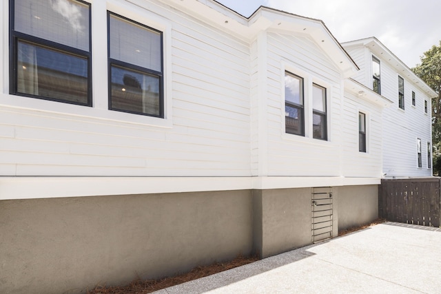 view of side of property featuring a patio area