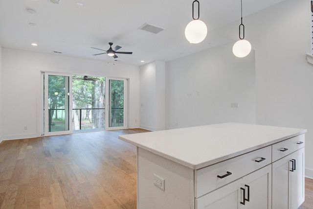 4067 S Rhett Ave, North Charleston, SC 29405 - kitchen featuring light wood-style floors, ceiling fan, decorative light fixtures, open floor plan, and baseboards