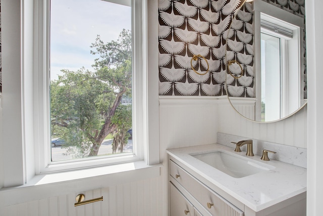 4067 S Rhett Ave, North Charleston, SC 29405 - bathroom with vanity, a wainscoted wall, and healthy amount of natural light
