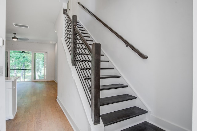 4067 S Rhett Ave, North Charleston, SC 29405 - stairs with wood finished floors and baseboards