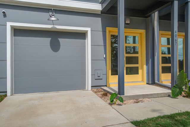 4067 S Rhett Ave, North Charleston, SC 29405 - entrance to property with stucco siding, concrete driveway, and a garage