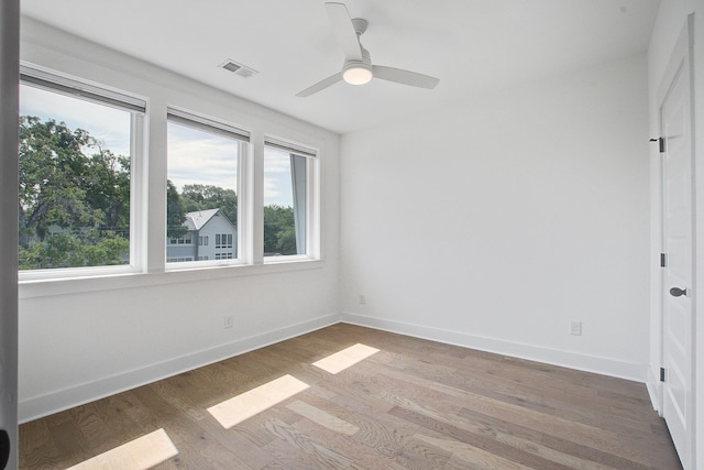 4067 S Rhett Ave, North Charleston, SC 29405 - empty room with plenty of natural light, wood finished floors, and baseboards