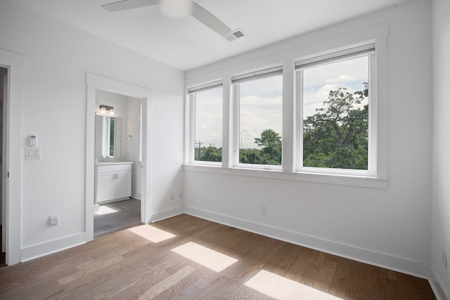 4067 S Rhett Ave, North Charleston, SC 29405 - unfurnished bedroom featuring wood finished floors, baseboards, and ensuite bath