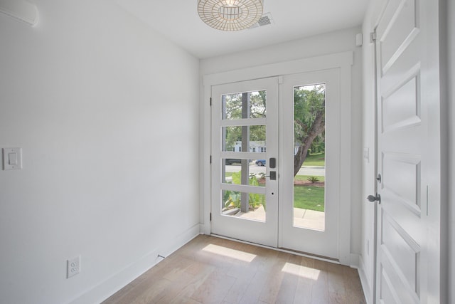 4067 S Rhett Ave, North Charleston, SC 29405 - doorway with wood finished floors, french doors, and baseboards