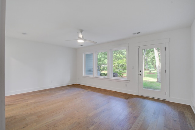 4067 S Rhett Ave, North Charleston, SC 29405 - spare room featuring wood finished floors, ceiling fan, and baseboards