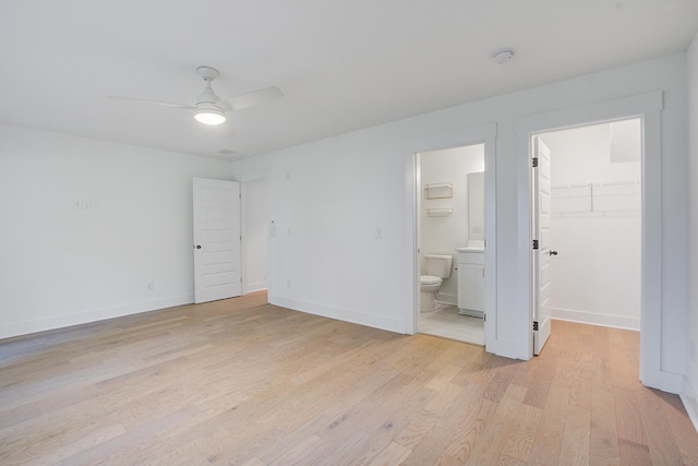 4067 S Rhett Ave, North Charleston, SC 29405 - unfurnished bedroom with light wood-type flooring, ensuite bath, a walk in closet, and baseboards