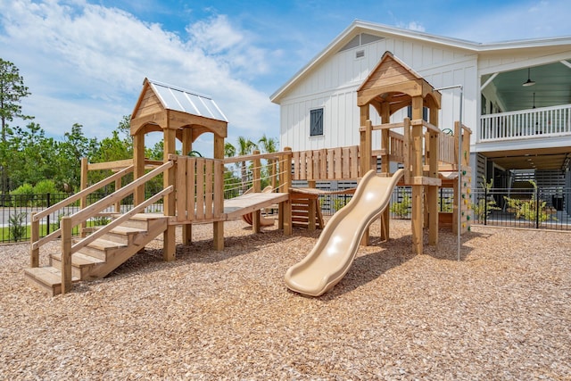 view of playground featuring fence