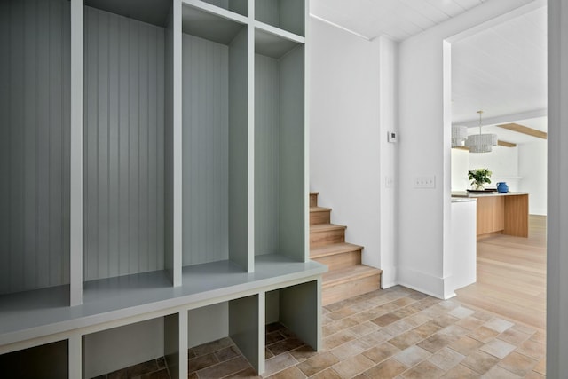 mudroom with light stone finish floors