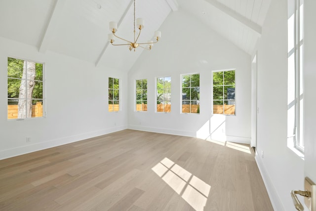 unfurnished sunroom featuring a chandelier and plenty of natural light