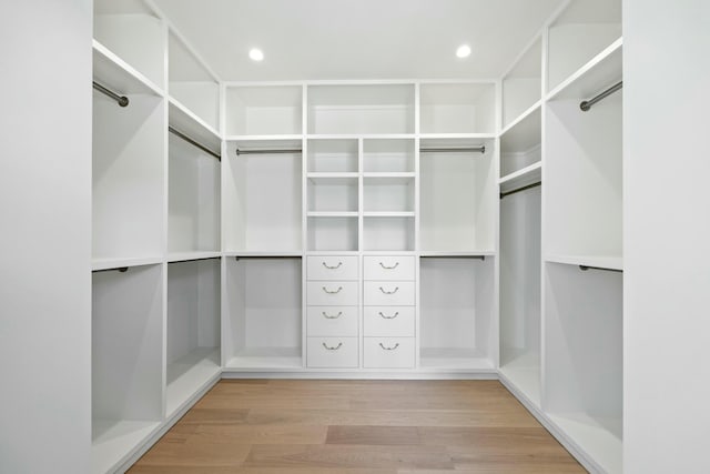 walk in closet featuring light wood-style floors
