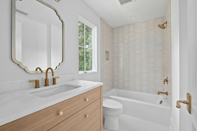 bathroom with toilet, healthy amount of natural light, tub / shower combination, and tile patterned flooring