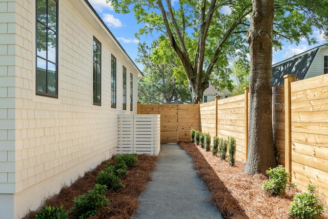 view of home's exterior featuring fence