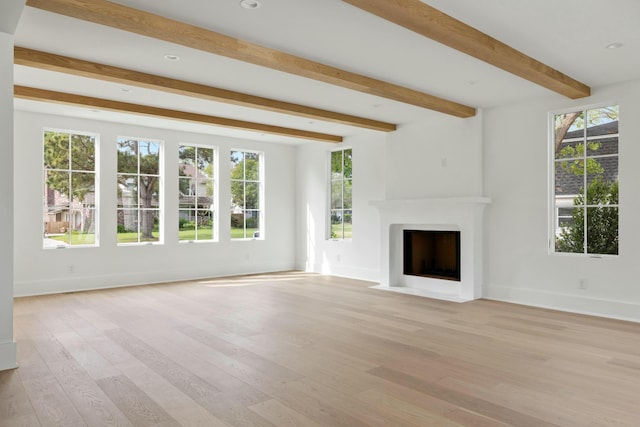 unfurnished living room featuring a fireplace with flush hearth, light wood-style flooring, beamed ceiling, baseboards, and recessed lighting