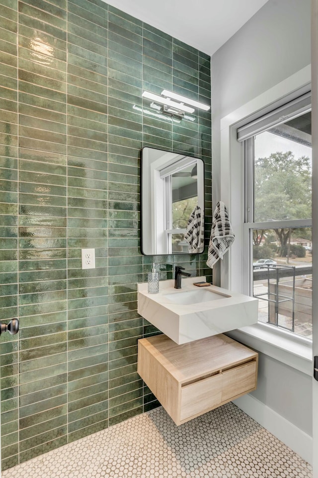 bathroom featuring tile patterned floors, vanity, and tile walls