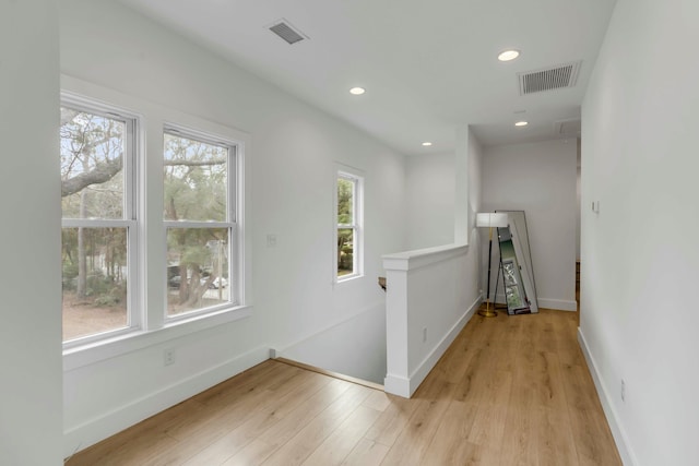 hall with light wood-type flooring