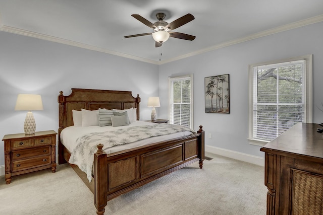 carpeted bedroom with ceiling fan and crown molding