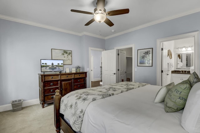 bedroom featuring ceiling fan, light colored carpet, crown molding, and ensuite bath