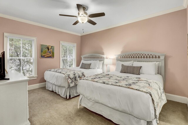 bedroom with ceiling fan, ornamental molding, and light carpet